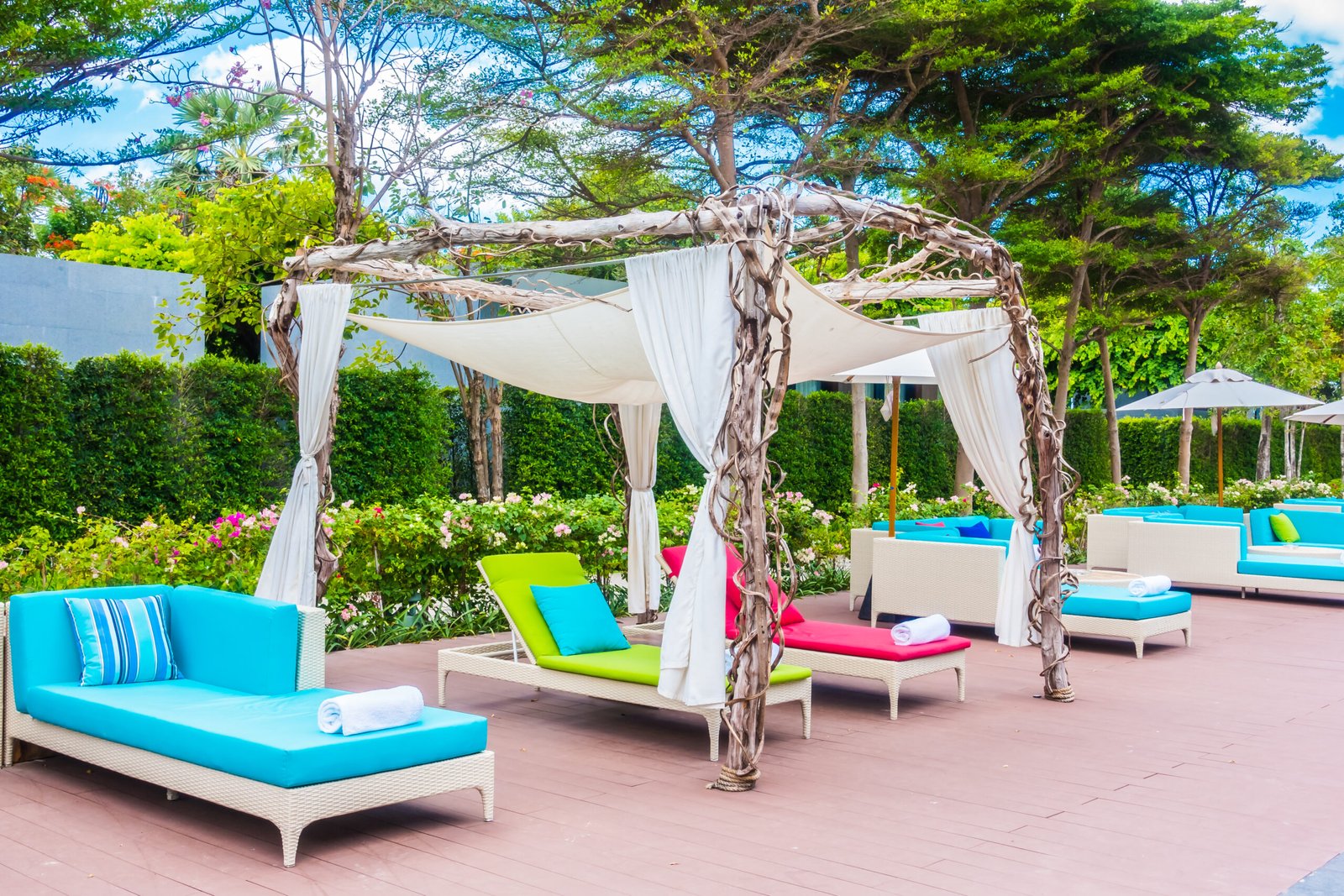Umbrella and chair around swimming pool